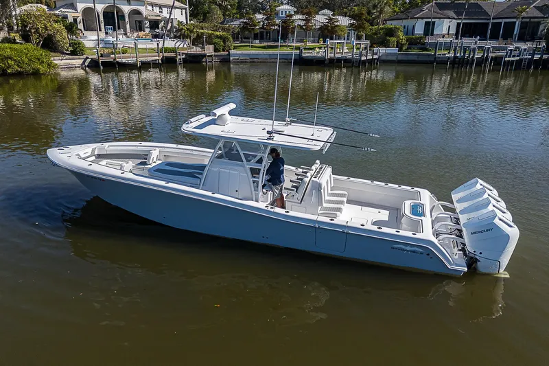  Yacht Photos Pics 2024 Invincible 39 Open Fisherman boat on calm water, side view.