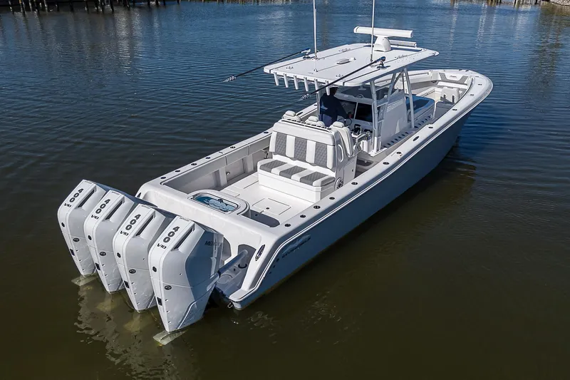  Yacht Photos Pics 2024 Invincible 39 Open Fisherman boat with quad engines on calm water.