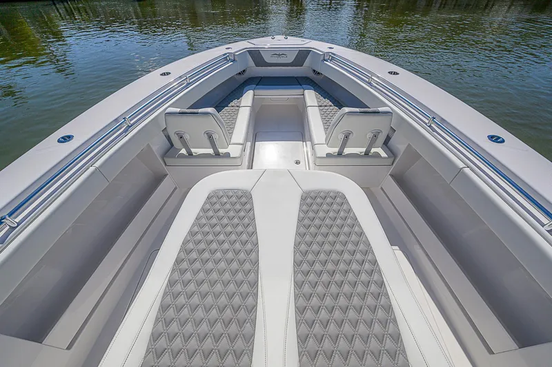  Yacht Photos Pics 2024 Invincible 39 Open Fisherman boat interior with cushioned seating and sleek design.