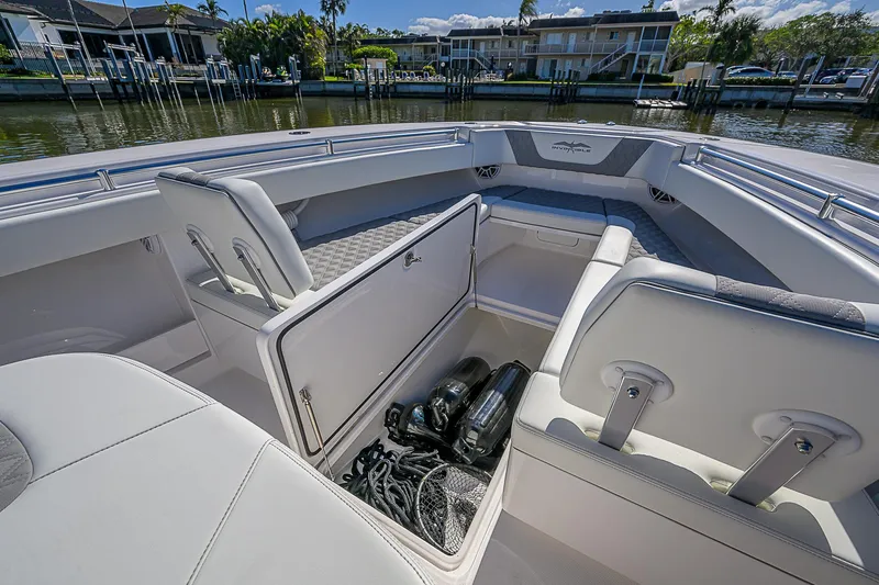  Yacht Photos Pics 2024 Invincible 39 Open Fisherman boat interior with storage compartment open.