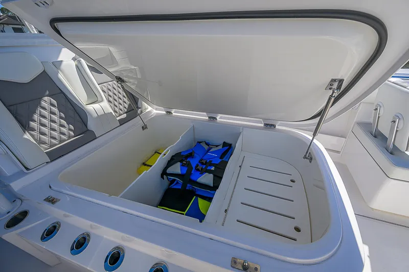  Yacht Photos Pics Open storage compartment on 2024 Invincible 39 Open Fisherman boat with life jackets inside.