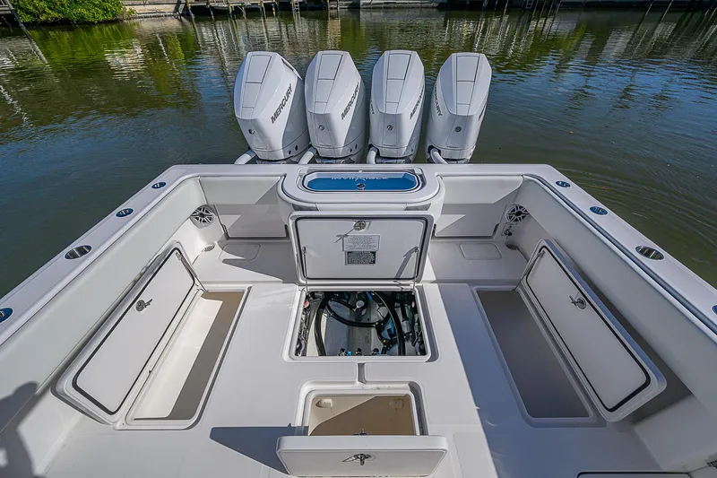  Yacht Photos Pics 2024 Invincible 39 Open Fisherman boat with quad engines, spacious deck, and storage compartments.