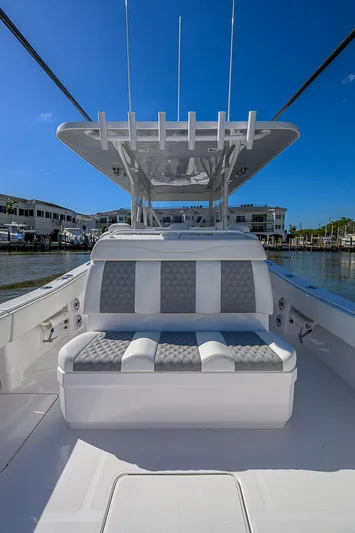  Yacht Photos Pics 2024 Invincible 39 Open Fisherman boat with cushioned seating and sleek design.