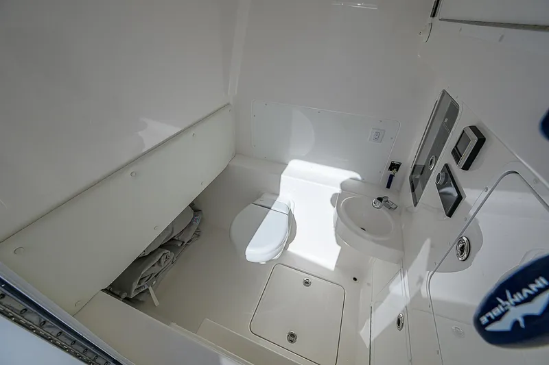  Yacht Photos Pics 2024 Invincible 39 Open Fisherman boat interior bathroom with toilet and sink.