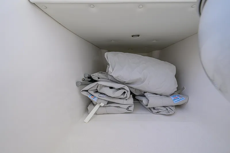  Yacht Photos Pics Storage compartment with folded covers in a 2024 Invincible 39 Open Fisherman boat.