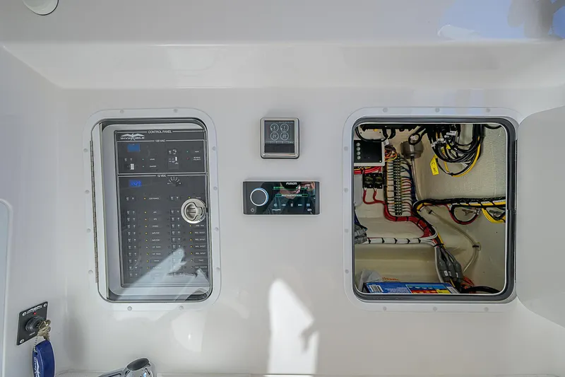  Yacht Photos Pics 2024 Invincible 39 Open Fisherman electrical panel and wiring compartment.