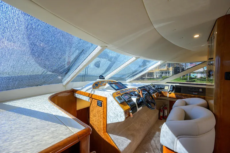Sea Hawk Yacht Photos Pics 1997 Fairline Squadron yacht interior helm with panoramic windows and luxurious seating.