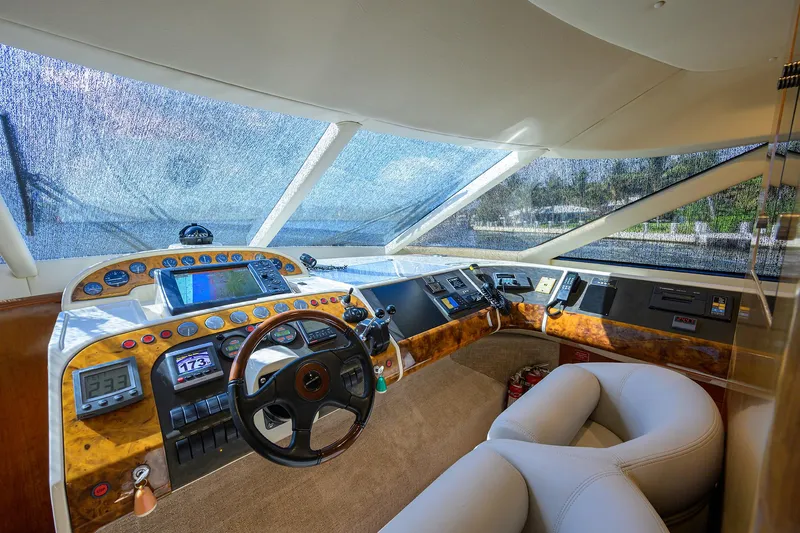 Sea Hawk Yacht Photos Pics 1997 Fairline Squadron yacht cockpit with modern navigation instruments and luxurious seating.