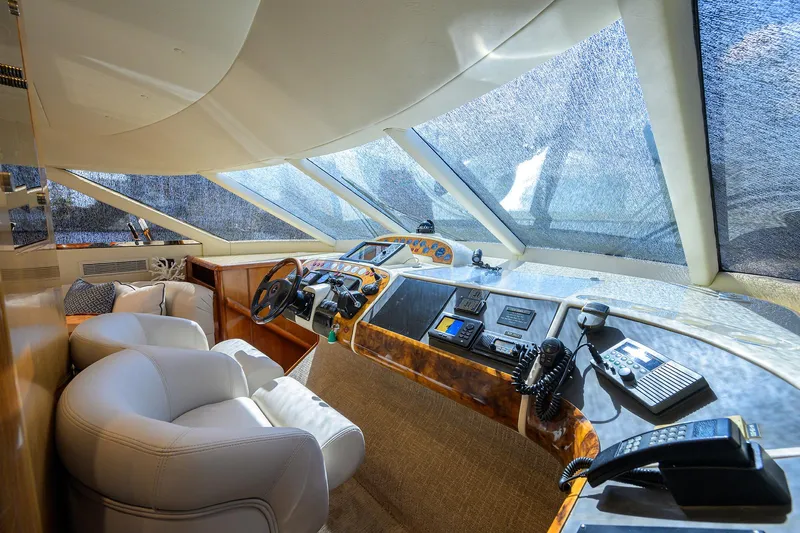 Sea Hawk Yacht Photos Pics 1997 Fairline Squadron yacht cockpit with luxurious seating and advanced navigation controls.