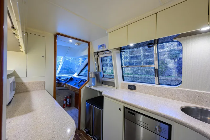 Sea Hawk Yacht Photos Pics 1997 Fairline Squadron yacht kitchen with modern appliances and ample counter space.