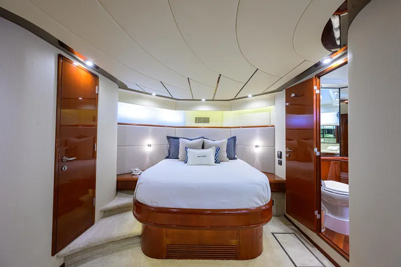 Sea Hawk Yacht Photos Pics Luxurious bedroom interior of a 1997 Fairline Squadron yacht with modern amenities.
