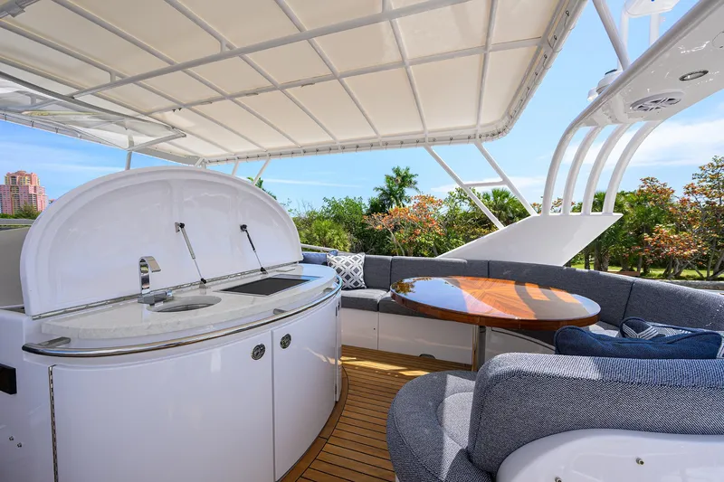 Sea Hawk Yacht Photos Pics 1997 Fairline Squadron yacht with outdoor seating and kitchenette under canopy.