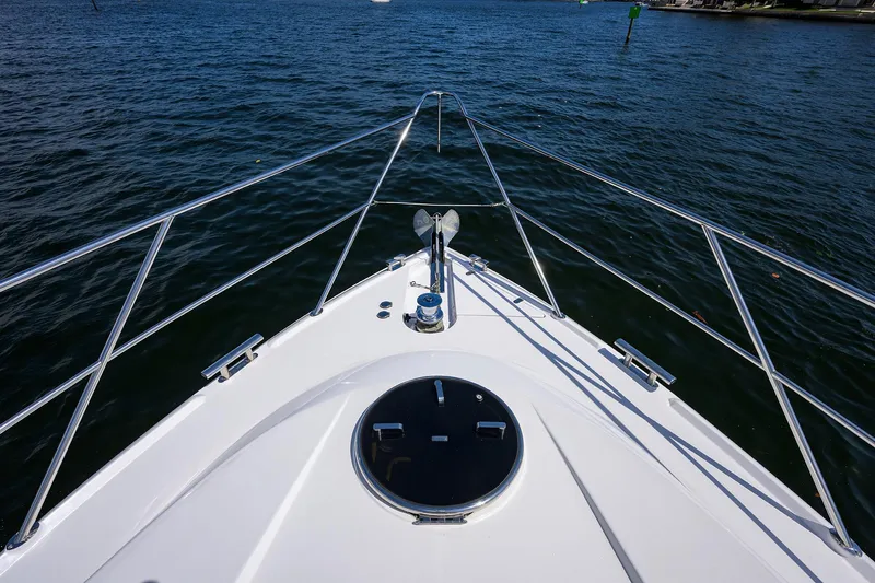 Sea Hawk Yacht Photos Pics Bow of a 1997 Fairline Squadron yacht cruising on open water.