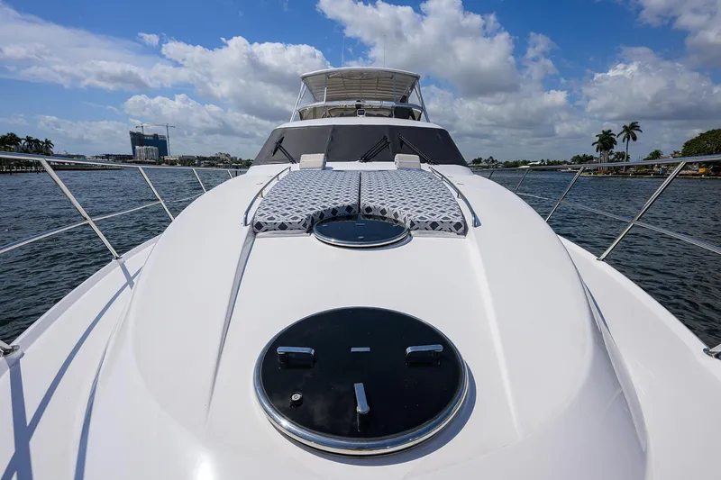 Sea Hawk Yacht Photos Pics 1997 Fairline Squadron yacht with sunbathing area on deck, cruising on a sunny day.