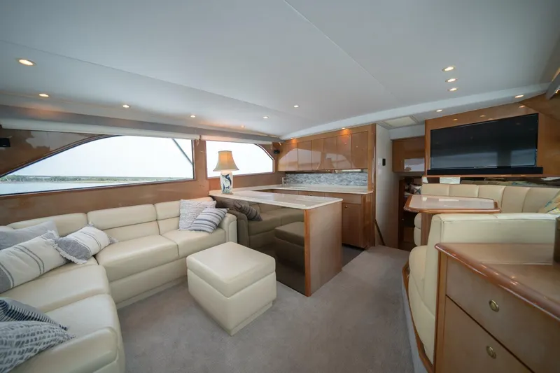  Yacht Photos Pics Luxurious interior of 2005 Viking 52 Convertible yacht with plush seating and modern amenities.