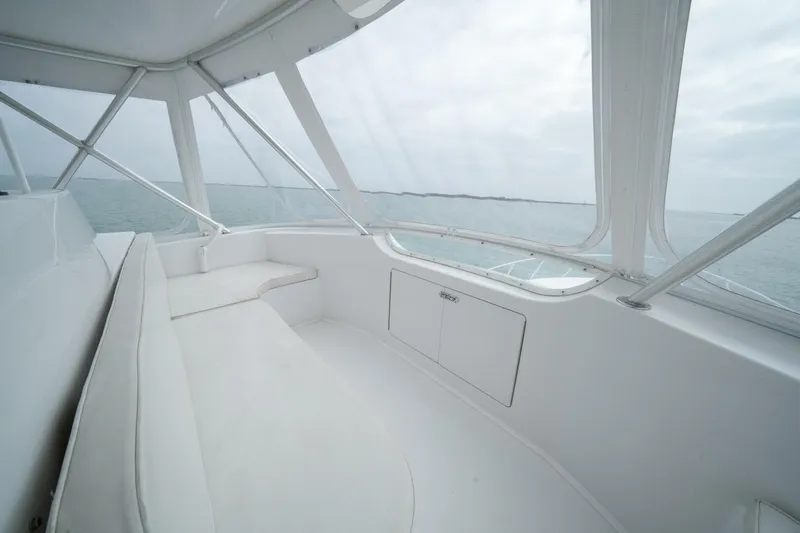  Yacht Photos Pics 2005 Viking 52 Convertible yacht interior with ocean view through windows.