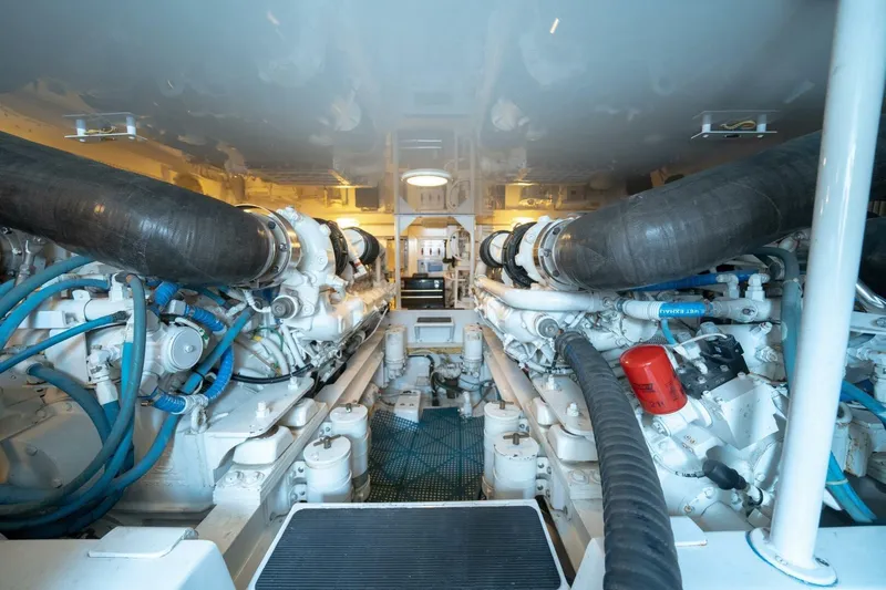  Yacht Photos Pics Engine room of 2005 Viking 52 Convertible yacht, showcasing dual engines and mechanical components.