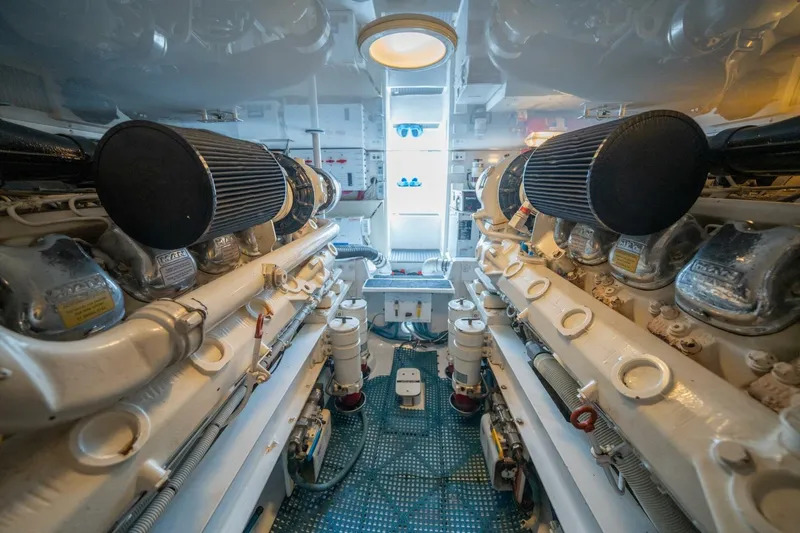  Yacht Photos Pics Engine room of a 2005 Viking 52 Convertible yacht, showcasing dual engines and mechanical components.