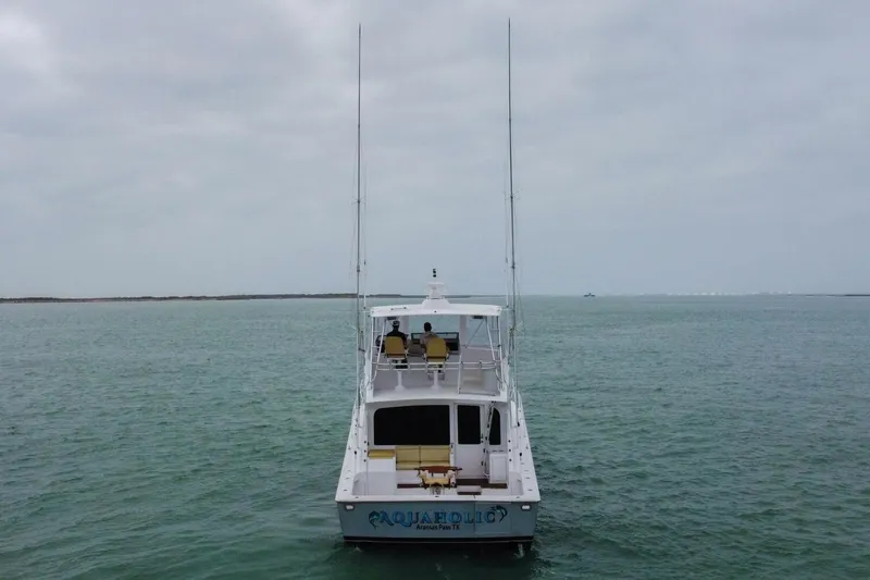  Yacht Photos Pics 2005 Viking 52 Convertible yacht on open water, rear view.