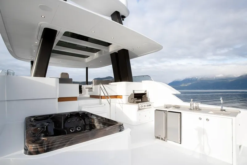 Crescent Lady Yacht Photos Pics Luxurious 2019 Crescent Semi-Displacement yacht deck with hot tub and outdoor kitchen.
