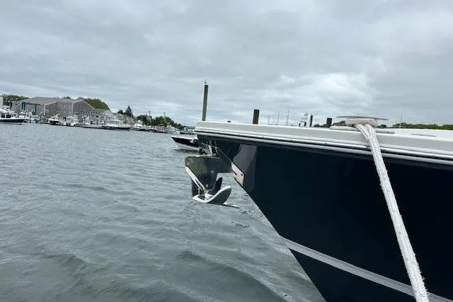  Yacht Photos Pics 2022 Regulator 41 boat anchored in a marina with cloudy skies.