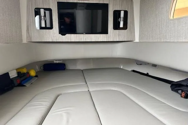  Yacht Photos Pics 2022 Regulator 41 cabin interior with bed, TV, and storage compartments.