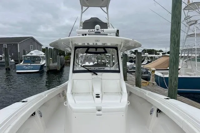  Yacht Photos Pics 2022 Regulator 41 boat docked at marina, featuring spacious deck and modern design.