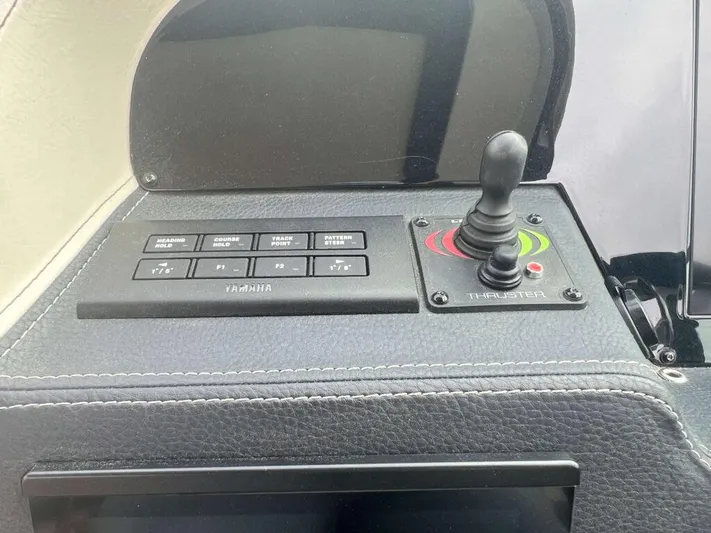  Yacht Photos Pics Control panel of 2025 Regal 33 OBX boat with joystick and buttons.