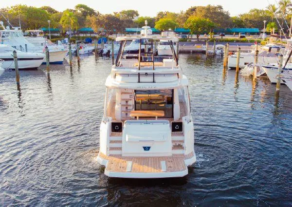  Yacht Photos Pics 2023 Greenline 45 Fly yacht docked in a marina, surrounded by other boats.