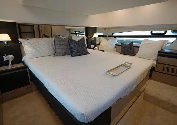 Yacht Photos Pics Luxurious bedroom interior of 2023 Greenline 45 Fly yacht with elegant bedding and modern decor.