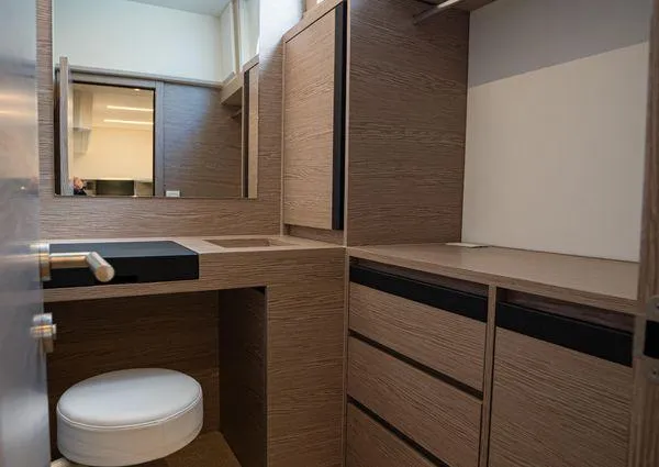  Yacht Photos Pics Modern bathroom interior on 2023 Greenline 45 Fly yacht, featuring wood cabinetry and sleek design.