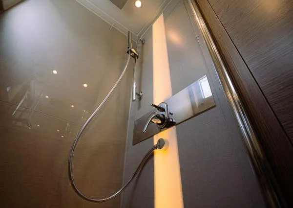  Yacht Photos Pics Modern shower in 2023 Greenline 45 Fly yacht, featuring sleek fixtures and ambient lighting.