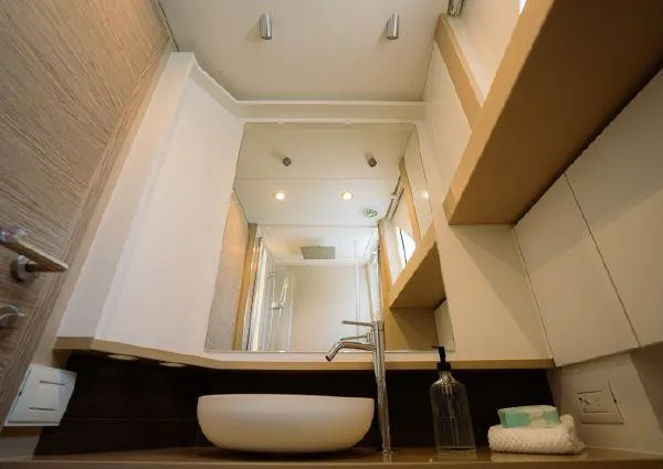  Yacht Photos Pics Modern bathroom interior on 2023 Greenline 45 Fly yacht, featuring sleek sink and mirror.