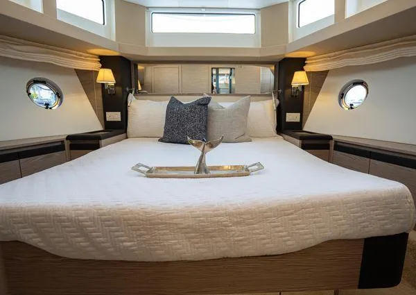  Yacht Photos Pics Luxurious bedroom interior of 2023 Greenline 45 Fly yacht with elegant decor and ambient lighting.