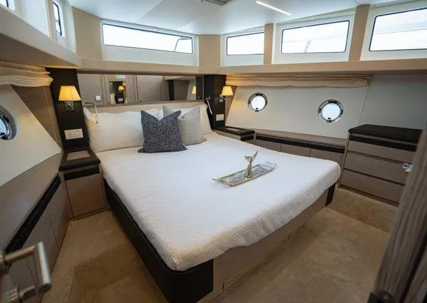  Yacht Photos Pics Luxurious bedroom interior of 2023 Greenline 45 Fly yacht with modern design and natural light.