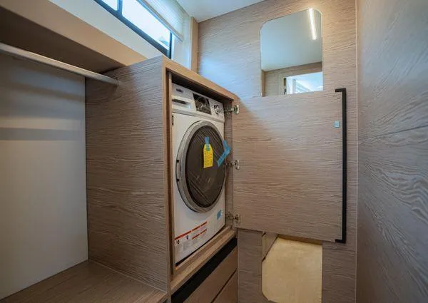  Yacht Photos Pics Laundry area with washer in 2023 Greenline 45 Fly yacht interior.