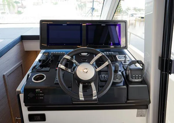  Yacht Photos Pics Helm station of 2023 Greenline 45 Fly yacht with dual screens and modern controls.