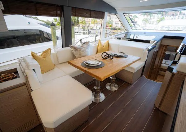  Yacht Photos Pics Luxurious interior of 2023 Greenline 45 Fly yacht with elegant dining area and plush seating.