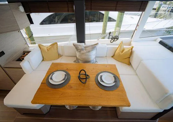  Yacht Photos Pics Luxurious interior of 2023 Greenline 45 Fly yacht with elegant dining setup.