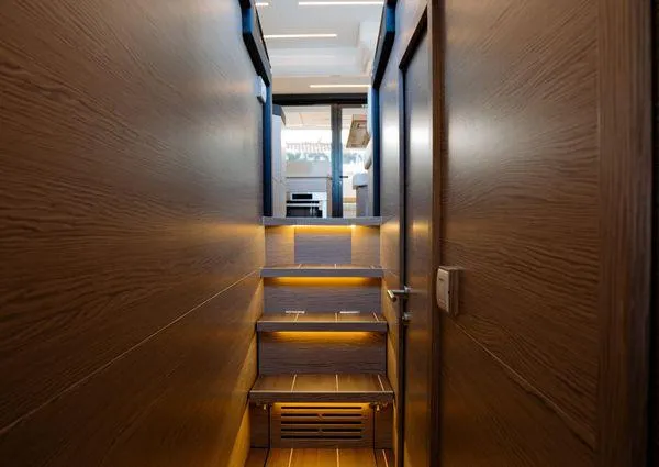  Yacht Photos Pics Interior of 2023 Greenline 45 Fly yacht with wooden stairs and modern lighting.