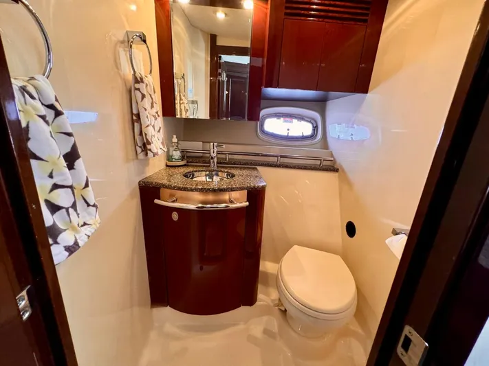 Isabela Yacht Photos Pics Luxurious bathroom in 2008 Sea Ray 48 Sundancer yacht with modern fixtures and elegant design.