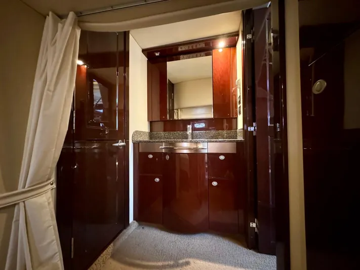 Isabela Yacht Photos Pics Luxurious interior of 2008 Sea Ray 48 Sundancer yacht with polished wood cabinetry.