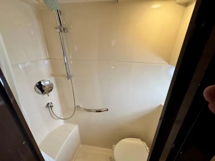 Isabela Yacht Photos Pics Bathroom interior of 2008 Sea Ray 48 Sundancer yacht with shower and toilet.