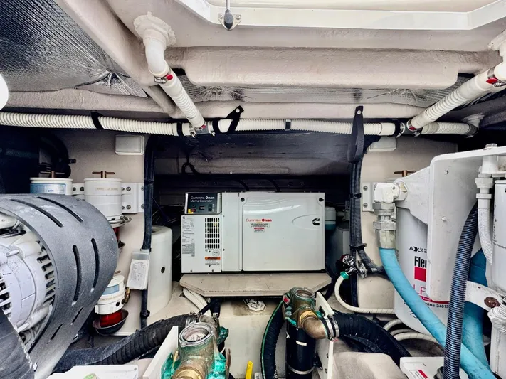 Isabela Yacht Photos Pics Engine room of 2008 Sea Ray 48 Sundancer, featuring generator and mechanical components.