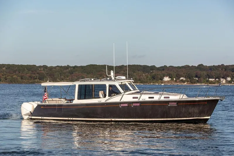 Goombay Yacht Photos Pics 2018 MJM 43z yacht cruising on a calm lake with scenic shoreline.