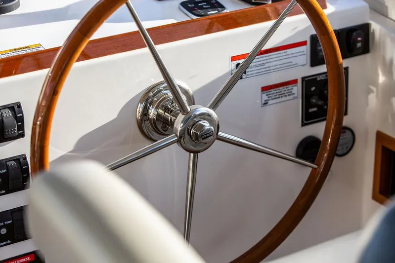 Goombay Yacht Photos Pics Steering wheel of 2018 MJM 43z boat, featuring wood and metal design.