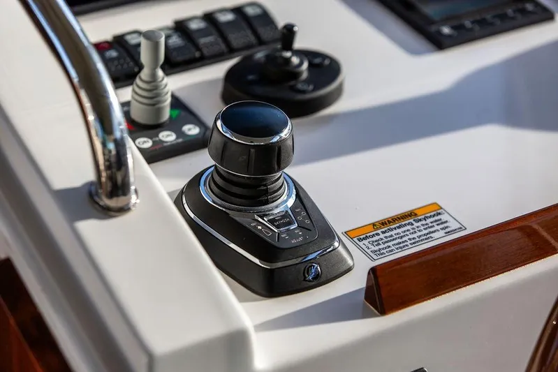 Goombay Yacht Photos Pics Control panel of 2018 MJM 43z boat with joystick and warning label.