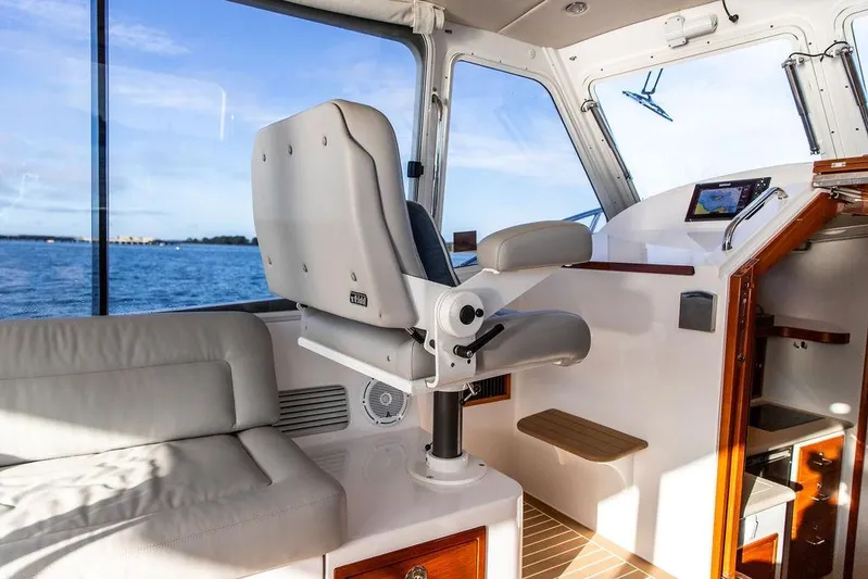 Goombay Yacht Photos Pics Interior of 2018 MJM 43z boat with helm seat and navigation equipment.