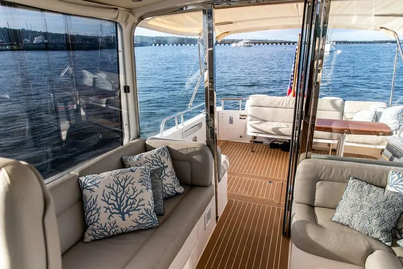 Goombay Yacht Photos Pics Luxurious interior of 2018 MJM 43z yacht with elegant seating and ocean view.