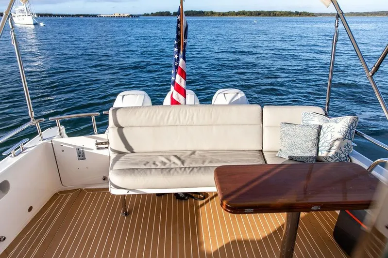 Goombay Yacht Photos Pics Luxury seating area on 2018 MJM 43z yacht with ocean view and American flag.